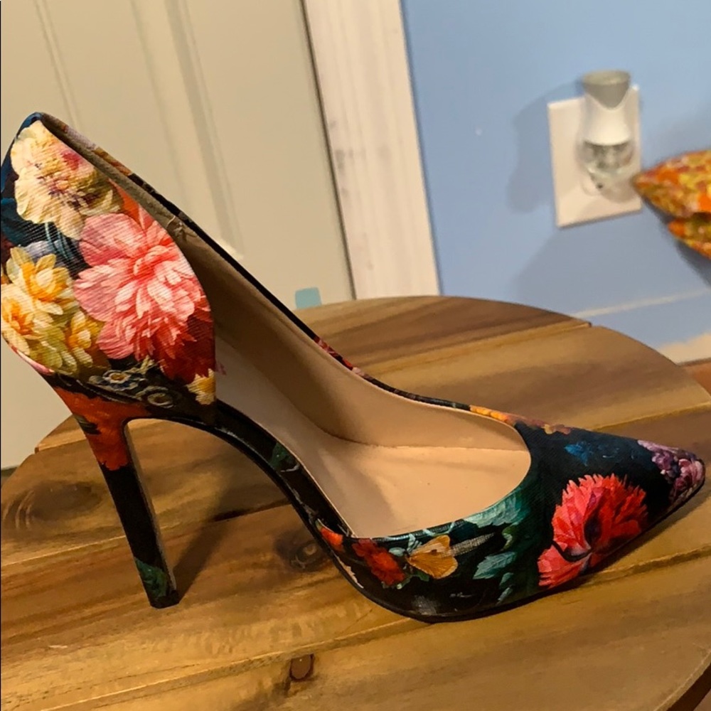 Multi colored floral heels. Never worn out. New!